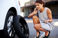 tire being changed by professional woman
