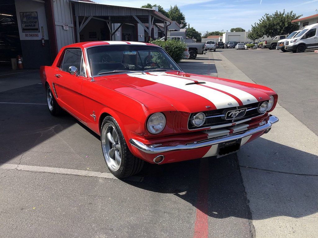 front 3/4 view - 1965 Ford Mustang - red - dual racing stripes